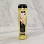 Shunga Desire massage olie fles van 240ml op witte achtergrond