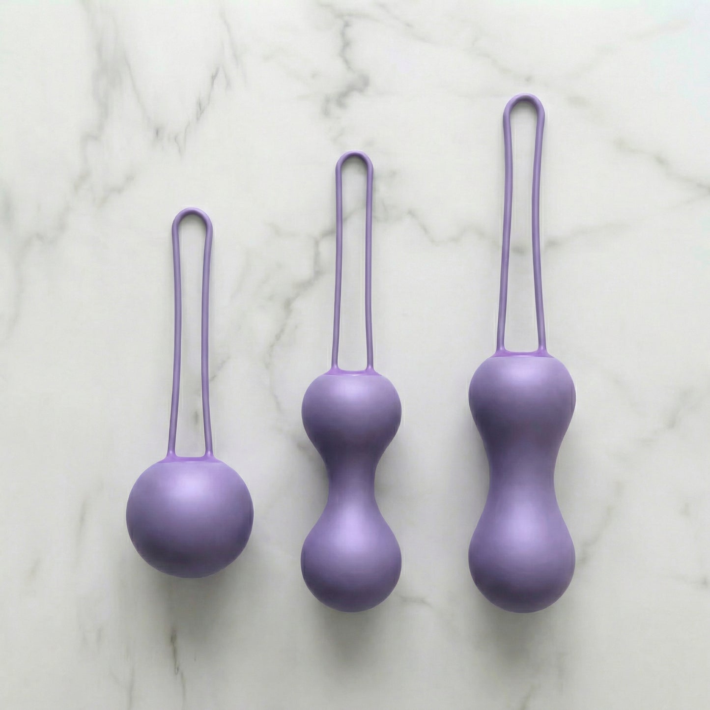 Je Joue Ami drie lila siliconen bekkenbodemballetjes in oplopende grootte met terugtreklusje